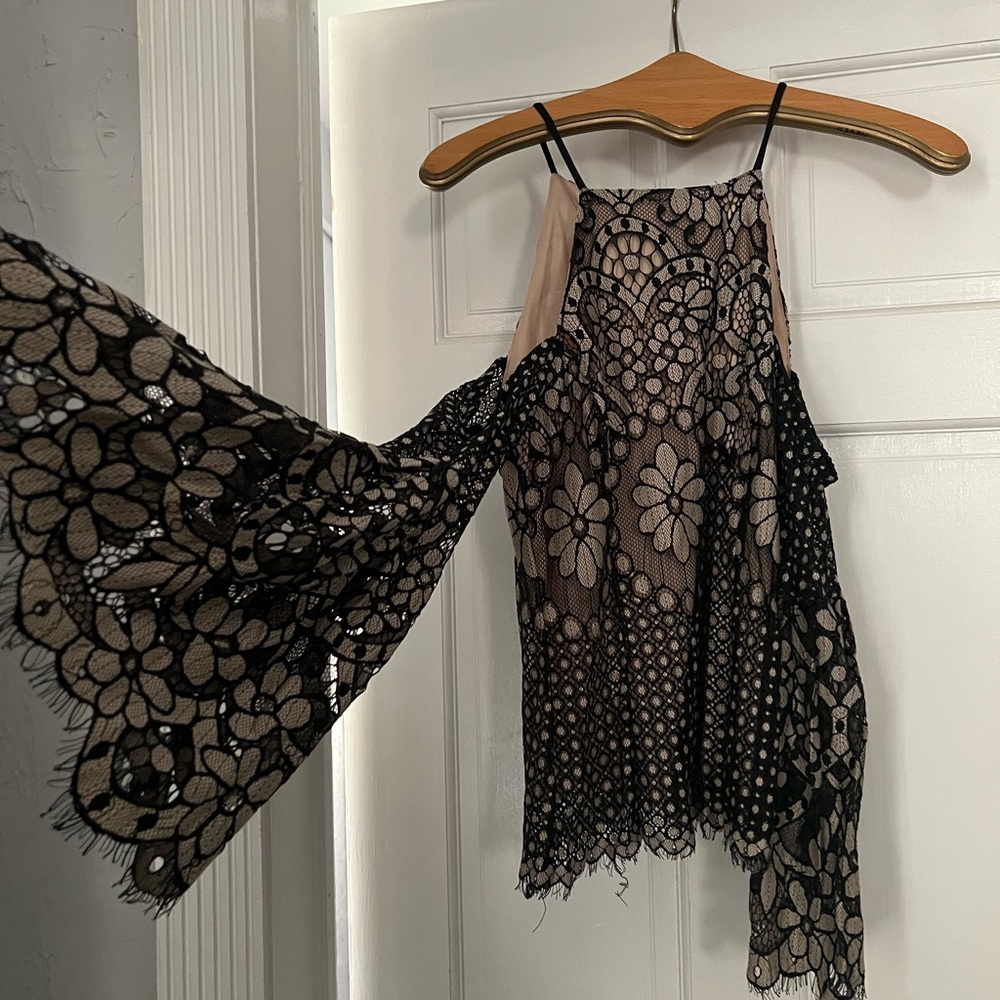 Beautiful, never worn dressy blouse.  Perfect with black slacks or jeans